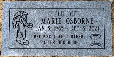 flat gray granite headstone with angel and school bus emblems